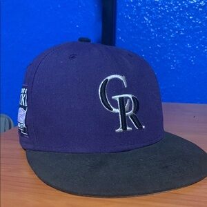 Purple and Black New Era 59fifty Colorado Rockies baseball cap. 7 1/8